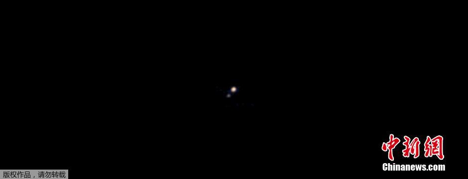 NASA“新视野号”拍下冥王星首张彩色照片