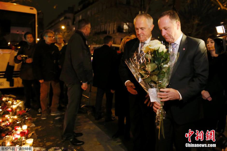巴黎气候大会与会领导人献花 悼念恐袭遇难者