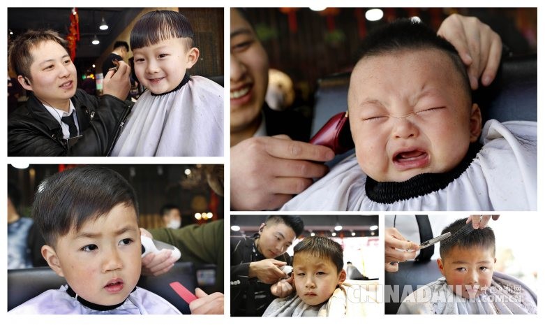 2016年3月10日,在江苏连云港市赣榆区一家理发店,理发师在为小朋友